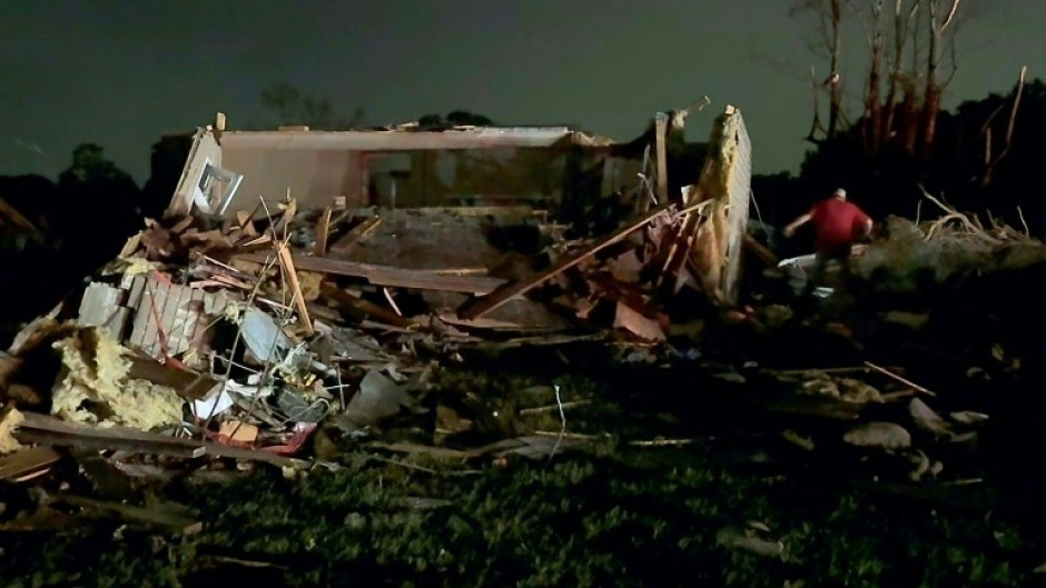 Local residents search through tornado damage in Laurel County near London, Kentucky