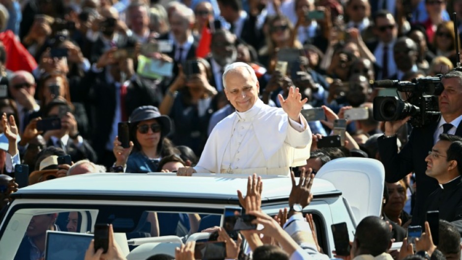 Pope Leo XIV made his debut tour in a popemobile, smiling, waving energetically and blessing the cheering crowds at the Vatican