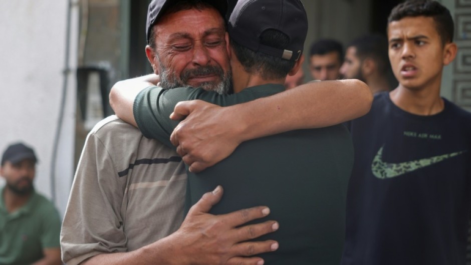 Palestinians mourn relatives killed in Israeli strikes, in Gaza City