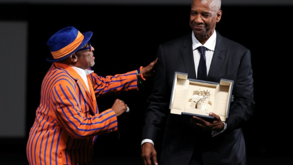 US actor Denzel Washington receives the award from US director Spike Lee
