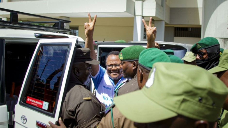 Mwangi had travelled to Dar es Salaam to show solidarity with arrested opposition leader Tundu Lissu (centre)