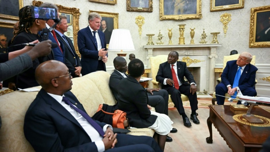 South African golfer Ernie Els, standing, speaks during the Oval Office meeting between US President Donald Trump and South African President Cyril Ramaphosa