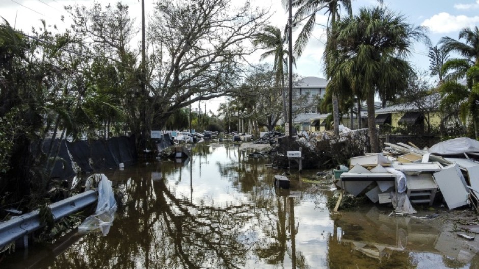 A flooded street with debris in the aftermath of Hurricane Milton, in Siesta Key, Florida, on October 10, 2024