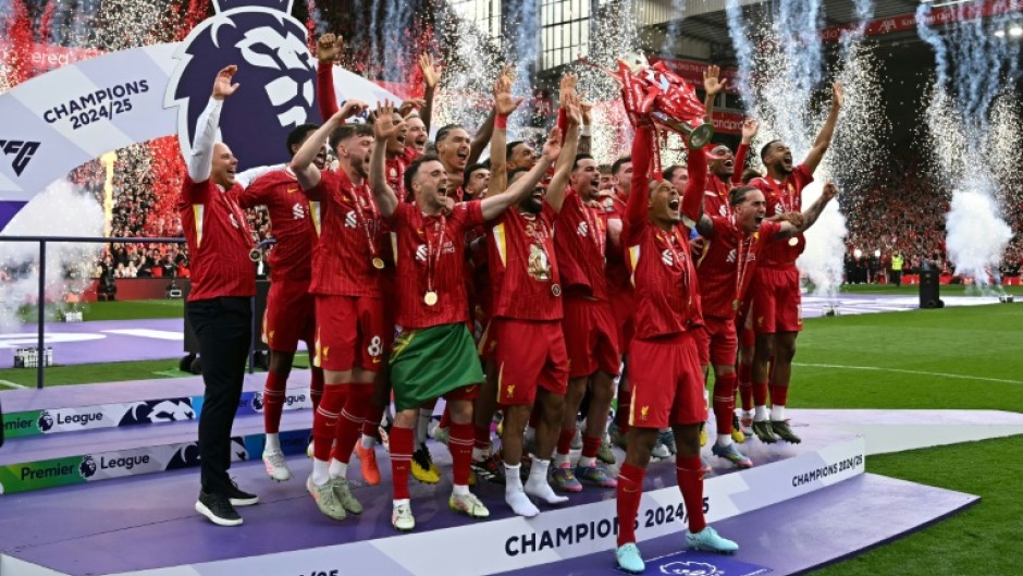 Liverpool's Virgil van Dijk lifts the Premier League trophy