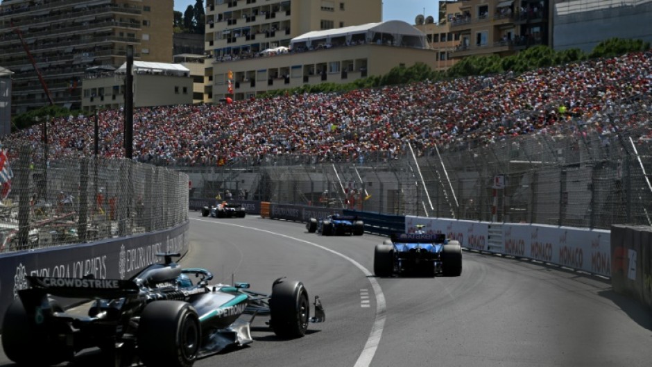 Traffic jam: Mercedes driver George Russell (L) grew frustrated when he was stuck behind the the slow-moving Williams cars on Sunday