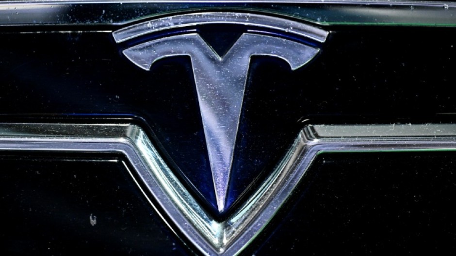 The logo of US company Tesla displayed at the Paris Motor Show at Paris Expo Porte de Versailles in Paris on October 16, 2024
