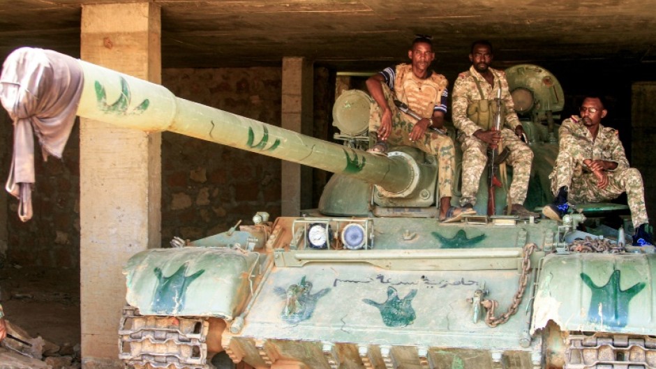 Sudanese soldiers on a tank after they captured a base used by the RSF in the Salha area of Omdurman, on May 26