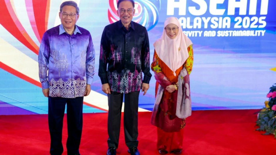 Chinese Premier Li Qiang (L) attended the ASEAN gala dinner on Monday, alongside Malaysian Prime Minister Anwar Ibrahim and his wife Wan Azizah Wan Ismail