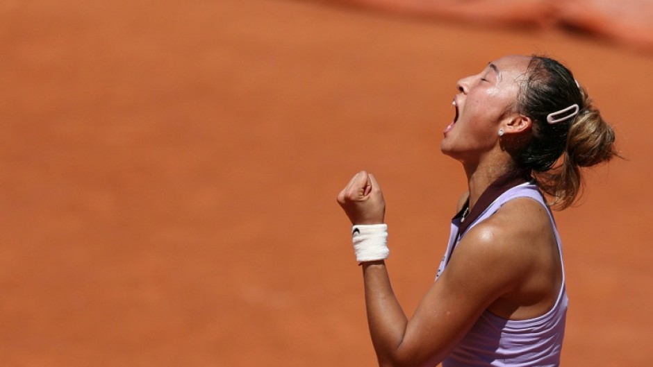 Olympic champion Zheng Qinwen celebrates booking her ticket to the last 16 at Roland Garros