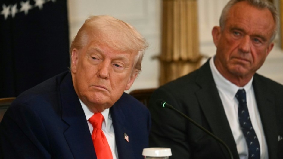 US President Donald Trump (L) and Health Secretary Robert F. Kennedy Jr. at the release of the MAHA report at the White House on May 22, 2025