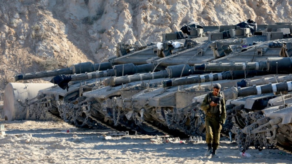 Israeli tanks take position on the Gaza border amid calls from a far-right minister to use "full force" in the battered territory.