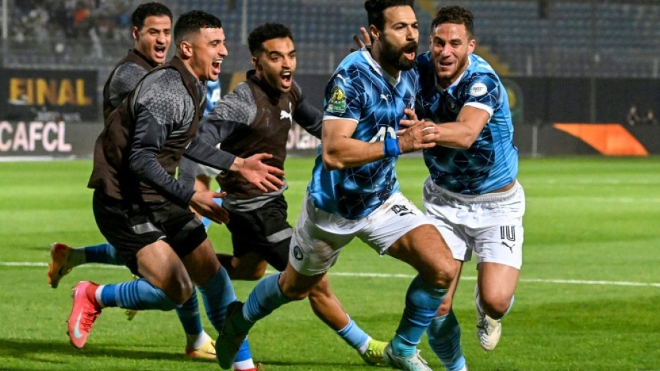 Pyramids defender Ahmed Samy (2R) celebrates scoring against Mamelodi Sundowns in the CAF Champions League final second leg in Cairo.