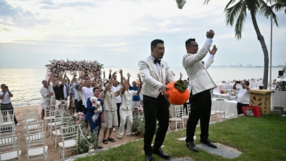 Song and Wang were surrounded by dozens of close friends and their ring-bearing small fluffy dog on their wedding day