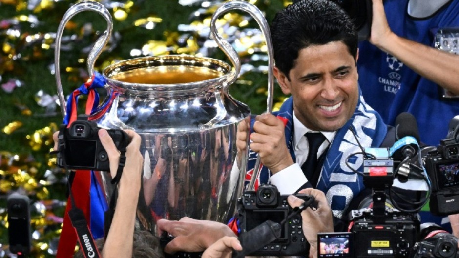 Paris Saint-Germain's Qatari president Nasser al-Khelaifi with the Champions League trophy on Saturday