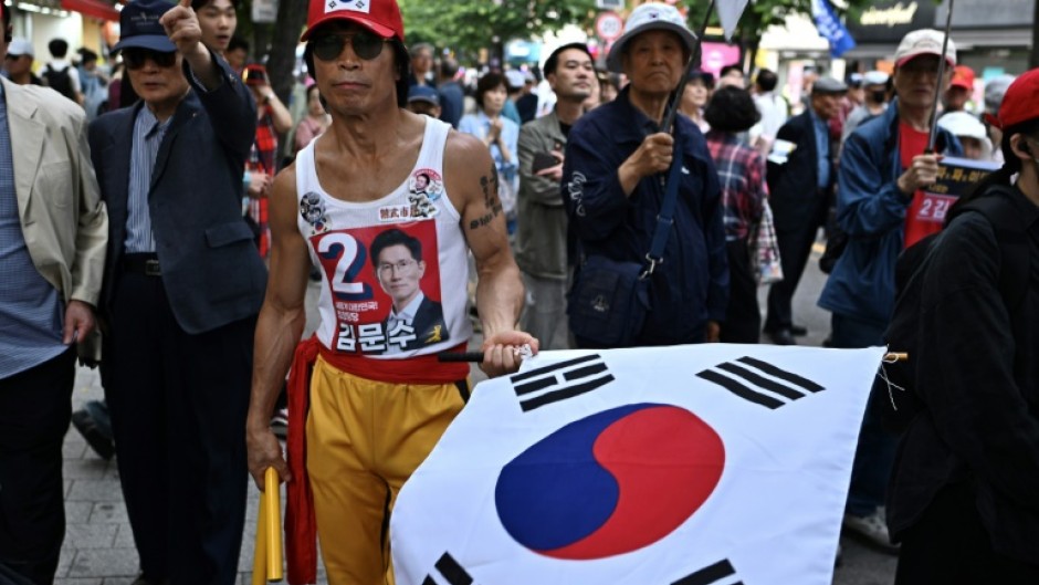 Supporters of South Korean presidential candidate Kim Moon-soo of the People Power Party attend a campaign event ahead of the presidential election
