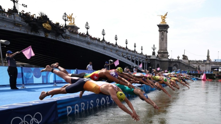Athletes dive into the Seine during the Paris 2024 Olympic Games