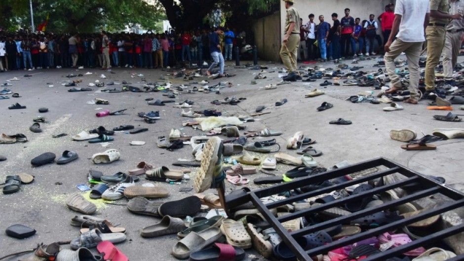 Abandoned shoes and a fallen barrier outside the Chinnaswamy Stadium in Bengaluru after a crush killed 11 people celebrating their team's IPL victory