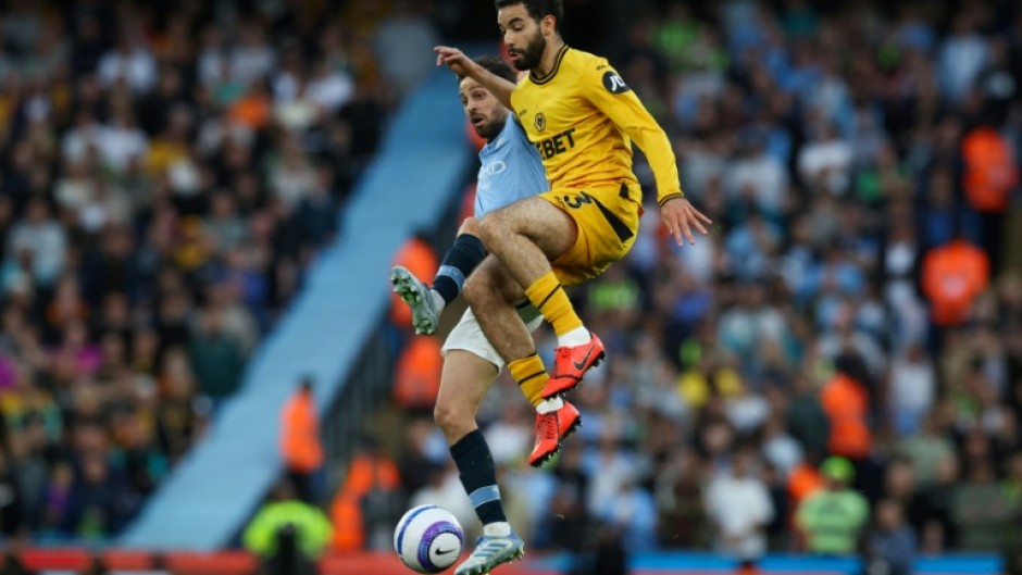 Wolves' Rayan Ait-Nouri (front) is set to join Man City