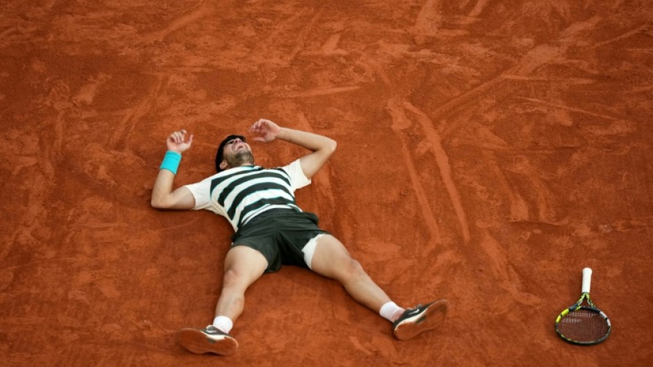 Carlos Alcaraz celebrates after an incredible French Open win over Jannik Sinner in five sets