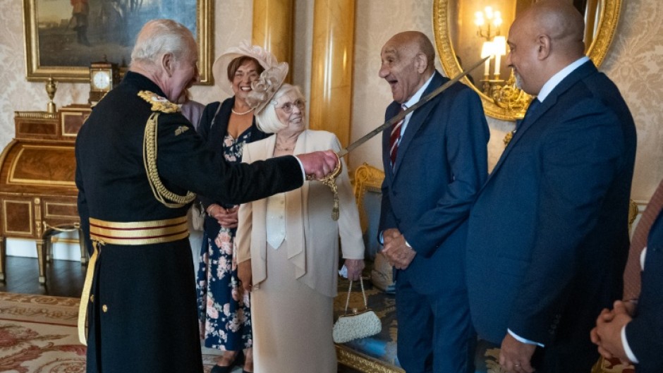 Former Rugby League player Billy Boston is knighted by Britain's King Charles III