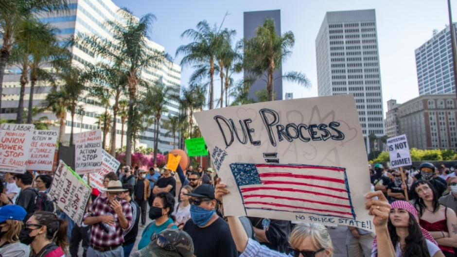 Over 1,000 people massed in America's second biggest city for a sixth day of protests, with the crowd peaceful as they marched through the streets