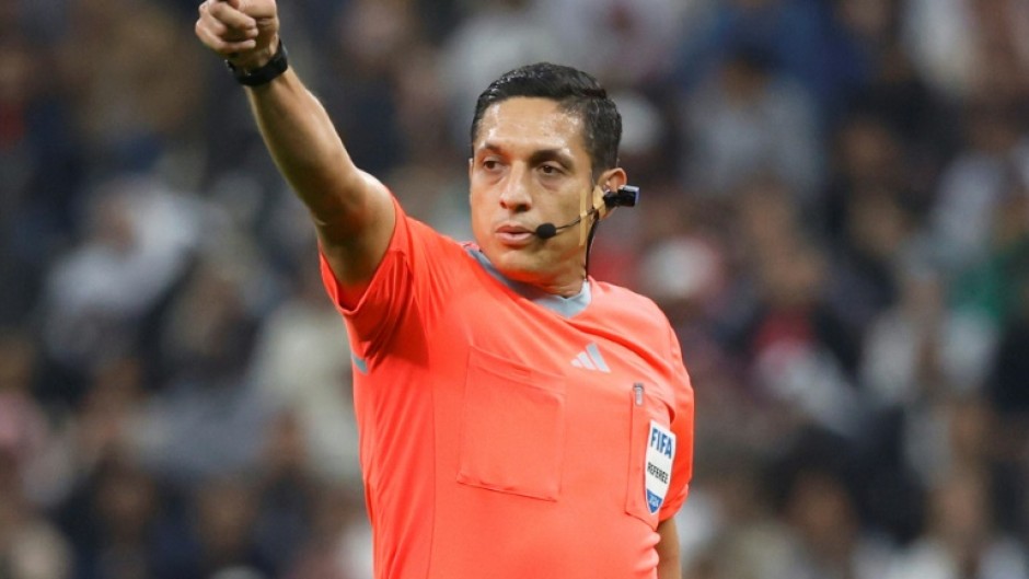 Venezuelan referee Jesus Valenzuela wearing the 'Ref Cam' during the 2024 FIFA Intercontinental Cup final football match between Spain's Real Madrid and Mexico's Pachuca at the Lusail Stadium in Doha on December 18, 2024.