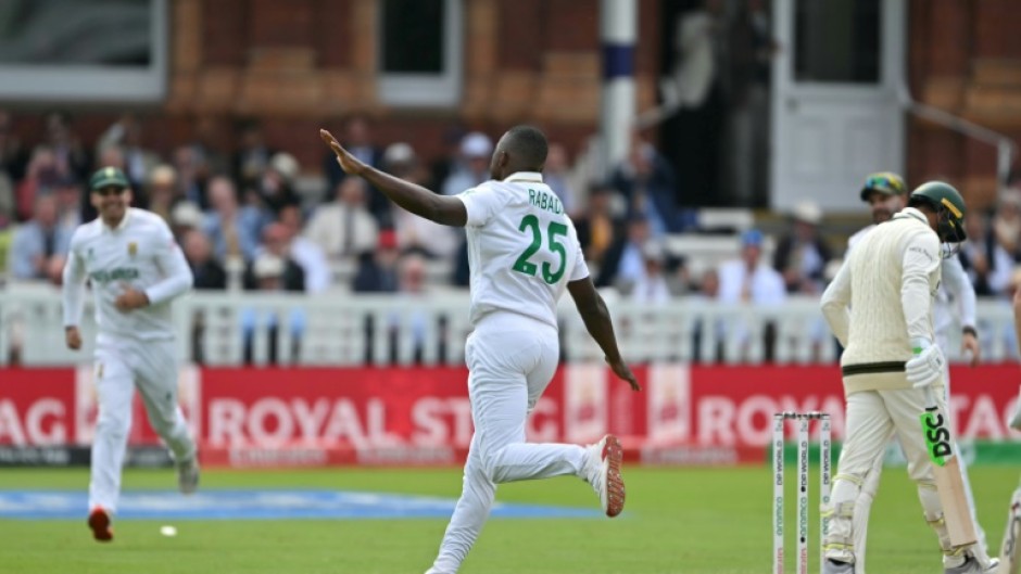 South Africa's Kagiso Rabada (C) celebrates taking the wicket of Australia's Usman Khawaja