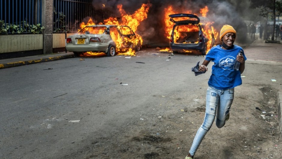 Protesters marched on parliament on Thursday, some throwing stones and police firing tear gas