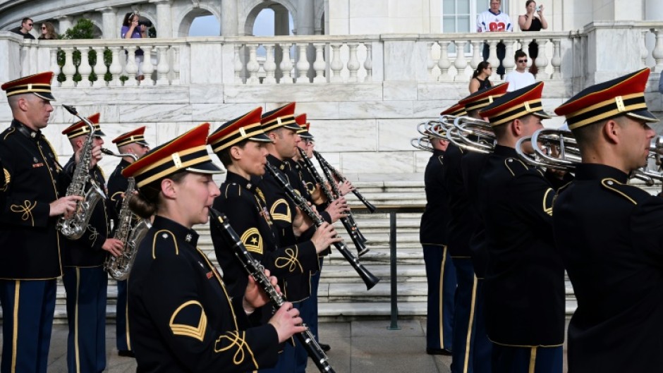 The US Army Band performs in honor of the Army's 250th birthday at the Tomb of the Unknown Soldier at Arlington National Cemetery -- ahead of a full military parade