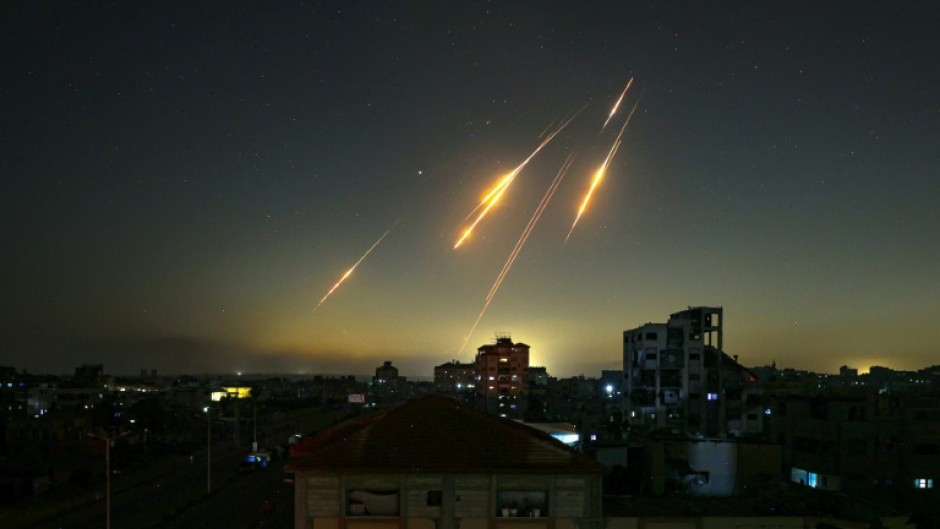 Missiles streak across the sky, as seen from the Gaza Strip