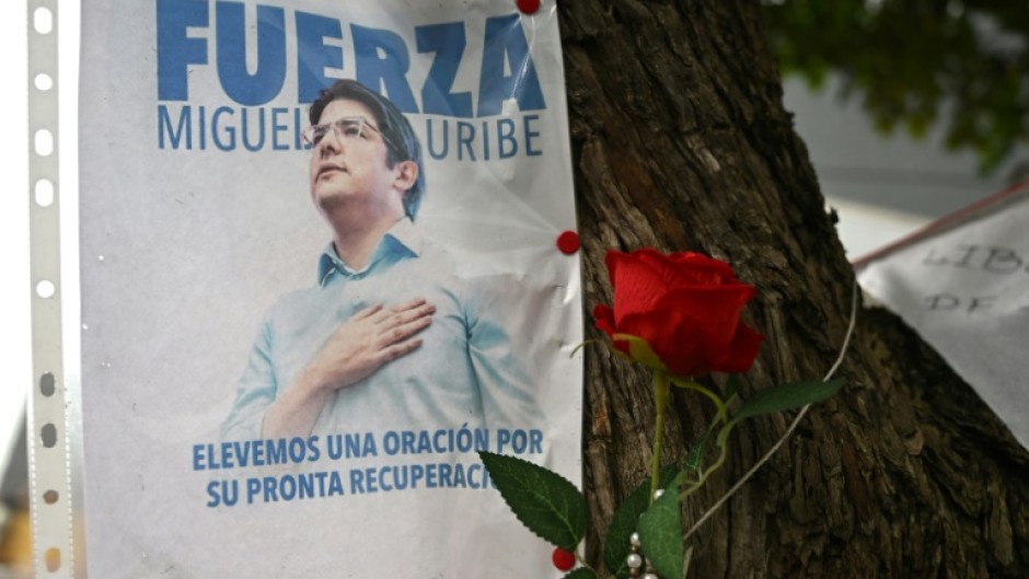 A poster is displayed during a mass for the health of Colombian senator Miguel Uribe, who was shot in Bogota in early June