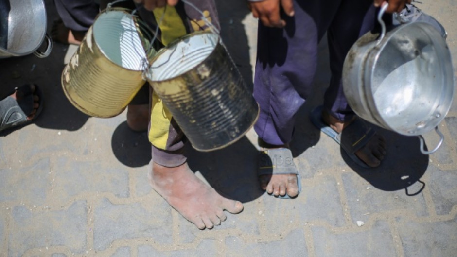 Thousands of Gazan children queue every day at community kitchens in the hope of securing food for their families
