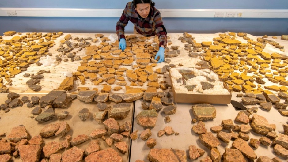 The reconstruction revealed bright yellow panel designs decorated with images of birds, fruit, flowers, and lyres not seen for 1800 years