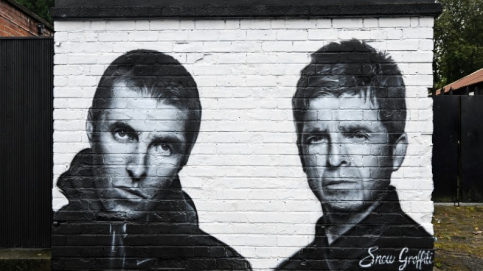 A mural by the artist known as Snow Graffiti of Liam and Noel Gallagher outside the Whitefield pub in Manchester, where they will play in July