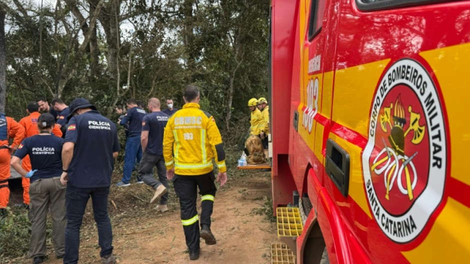 Brazilian rescue teams comb the spot in Praia Grande where a hot air balloon erupted in flames, killing at least eight people