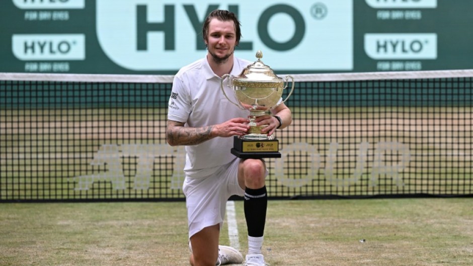 Kazakhstan's Alexander Bublik celebrates his second title on the grass of Halle, Germany