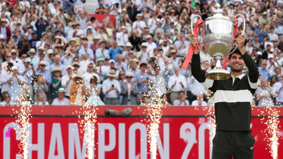 Spain's Carlos Alcaraz celebrates his second Queen's Club title before Wimbledon