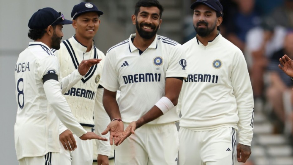 India's Jasprit Bumrah (C) celebrates with team-mates after dismissing England's Chris Woakes in the first Test at Headingley