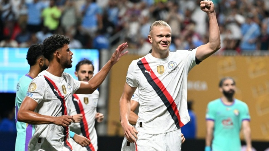 Manchester City striker Erling Haaland celebrates after tucking away his penalty
