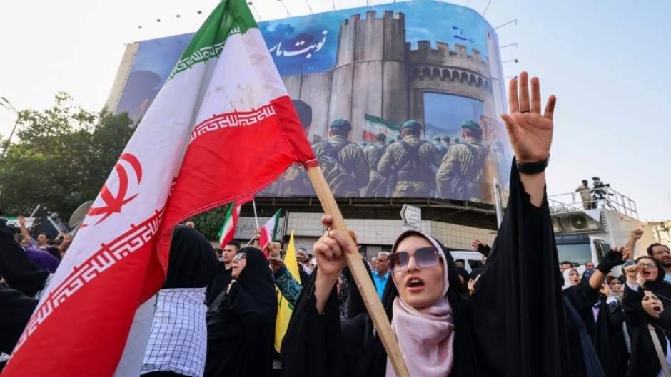 An Iranian woman at a rally protesting US strikes on nuclear sites, in Tehran
