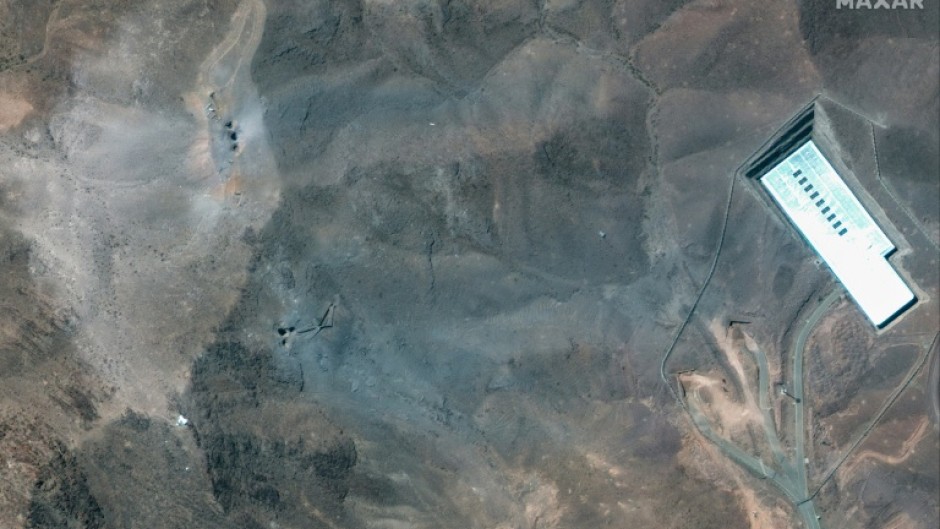 This handout satellite picture provided by Maxar Technologies and taken on June 22, 2025, shows a close-up view of craters after US strikes on Iran's Fordo Fuel Enrichment Plant (FFEP), northeast of the city of Qom