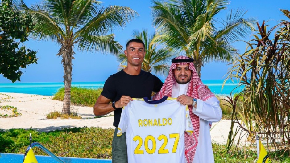 Cristiano Ronaldo (left) with Al Nassr's chairman Abdullah Al-Majid after signing a new deal