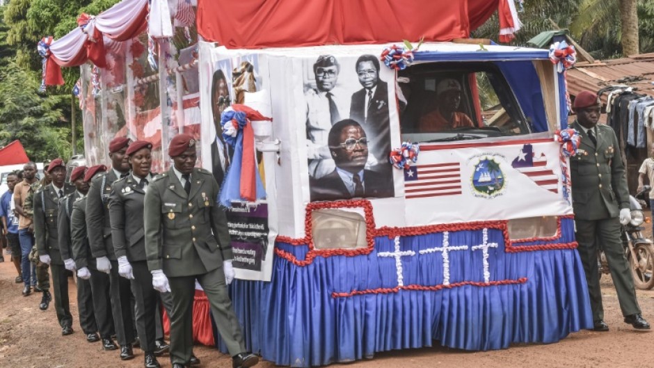 The funeral cortege for former Liberian president Samuel Doe and his wife Nancy was escorted by members of the armed forces
