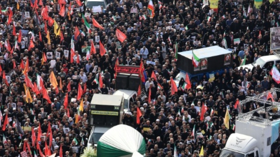 The funeral procession winds its way across the sprawling Iranian capital through crowds of black-clad mourners.