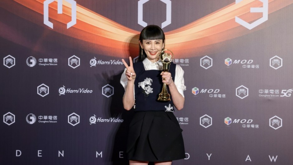 Taiwanese singer Waa Wei poses for photographs after winning the Best Female Singer (Mandarin) at the 36th Golden Melody Awards Ceremony at Taipei Arena, in Taipei on June 28, 2025