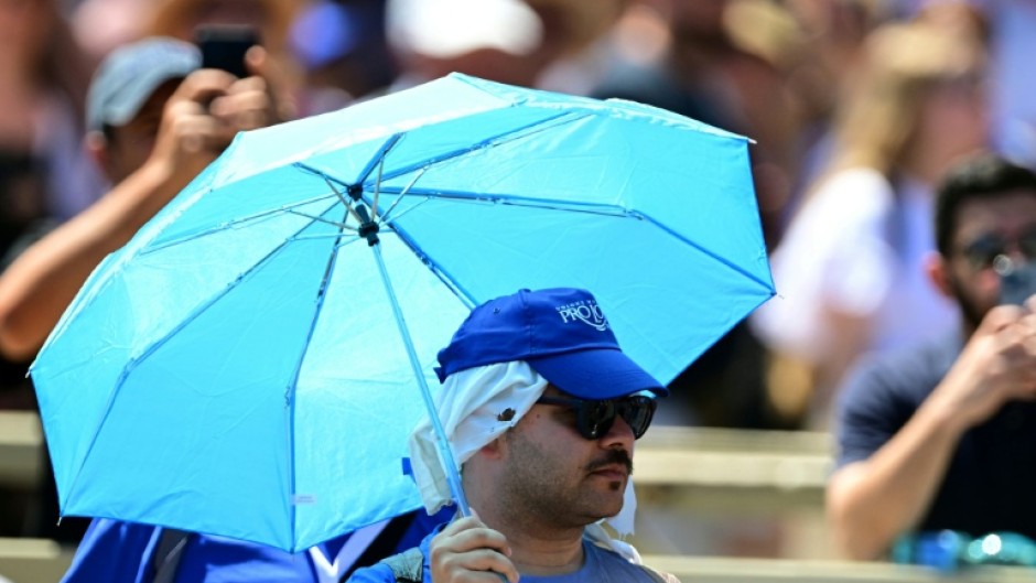Several people used parasols to hear Pope Leo XIV's address at St Peter's square in the Vatican on Sunday