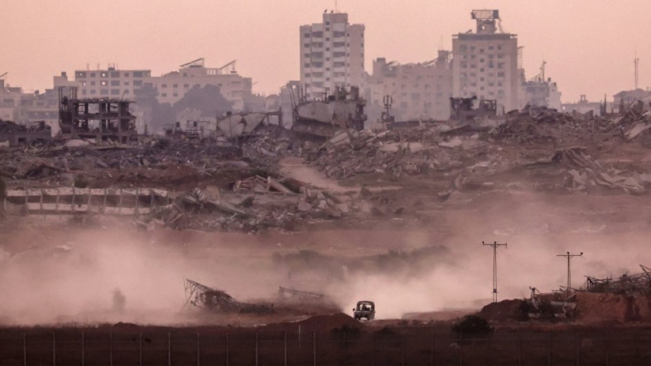 An Israeli military vehicle returning from the Gaza Strip into Israel