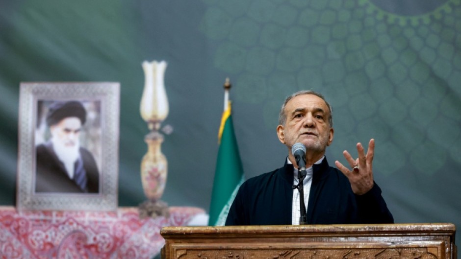 A handout picture shows Iran's President Masoud Pezeshkian giving an address in Tehran
