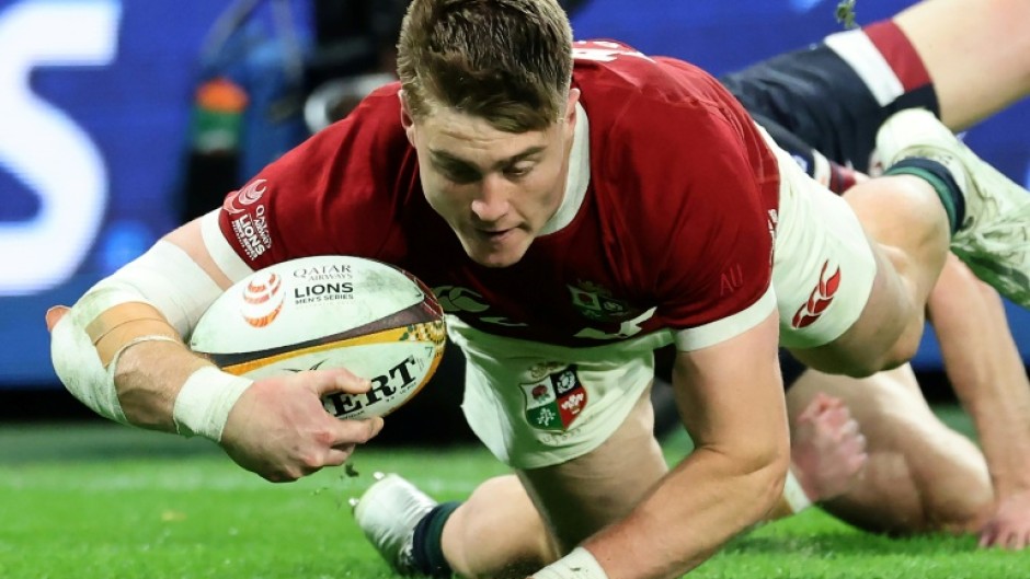 British and Irish Lions wing Tommy Freeman scores against Queensland Reds