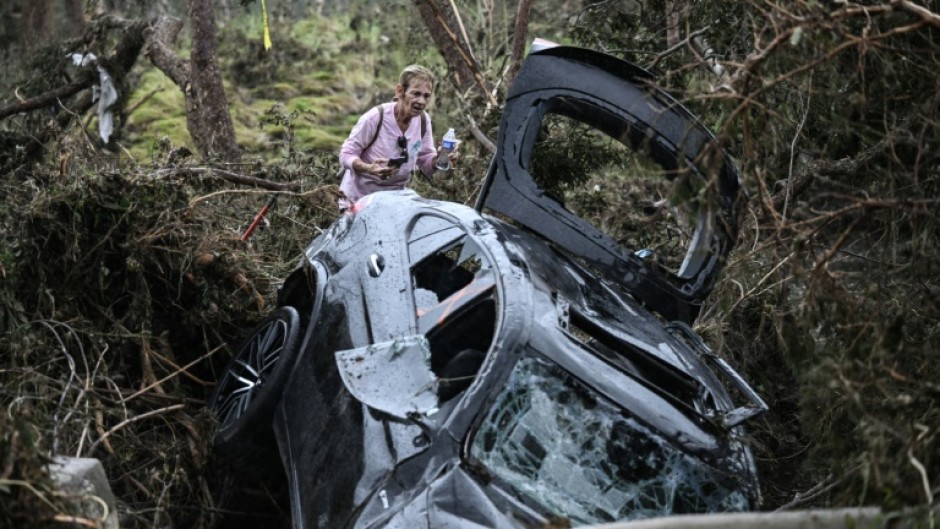 A volunteer looks for missing people, following severe flash flooding that occured during the July 4 holiday weekend, in Hunt, Texas, on July 6, 2025